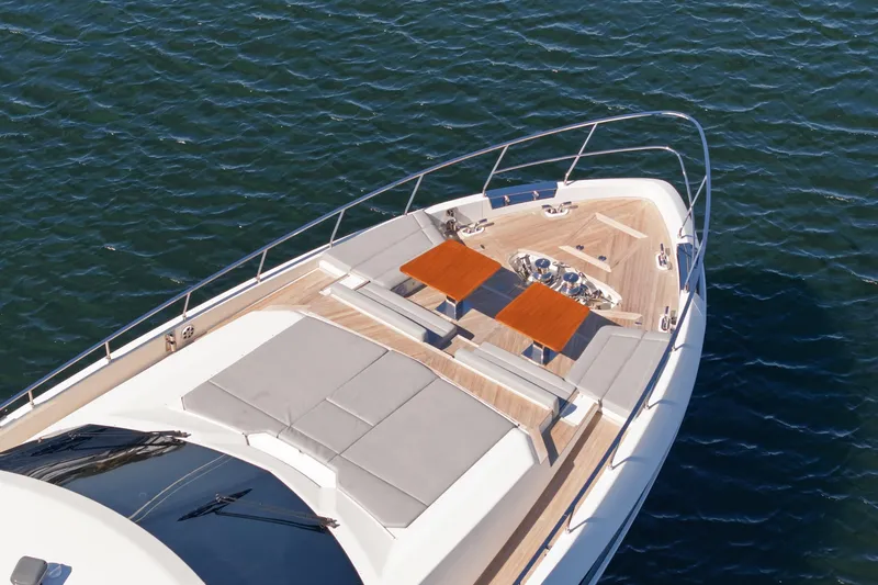 Date Night Yacht Photos Pics Luxury Ferretti Yachts 920 (2018) bow view with sunbathing area on water.