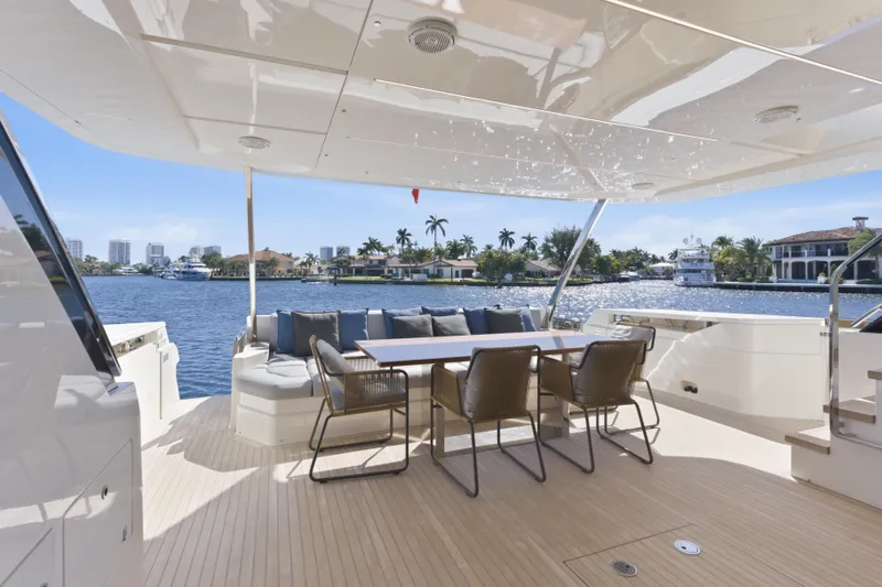 Date Night Yacht Photos Pics Luxurious 2018 Ferretti Yachts 920 deck with elegant seating and waterfront view.