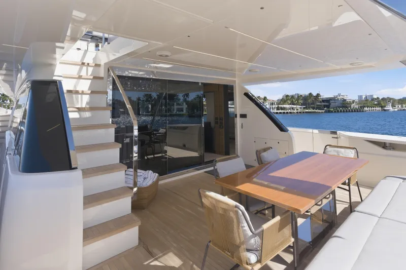 Date Night Yacht Photos Pics Luxurious 2018 Ferretti Yachts 920 deck with elegant seating and scenic waterfront view.