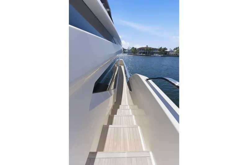 Date Night Yacht Photos Pics Side view of 2018 Ferretti Yachts 920 on a sunny day by the water.