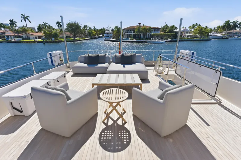 Date Night Yacht Photos Pics Luxurious 2018 Ferretti Yachts 920 deck with elegant seating and scenic waterfront view.