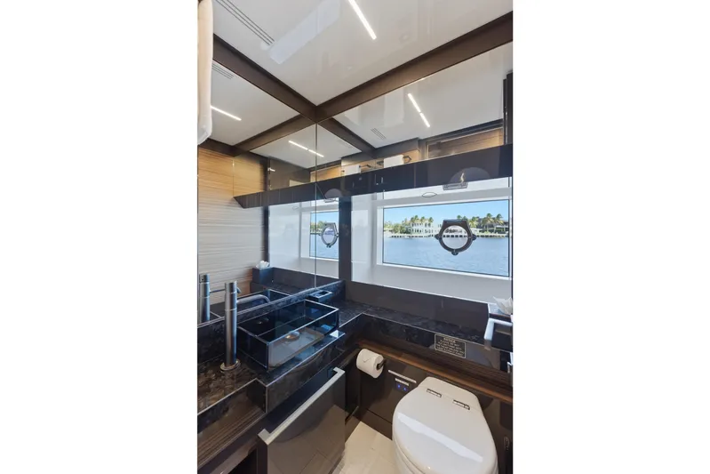 Date Night Yacht Photos Pics Luxurious bathroom interior of 2018 Ferretti Yachts 920 with ocean view window.