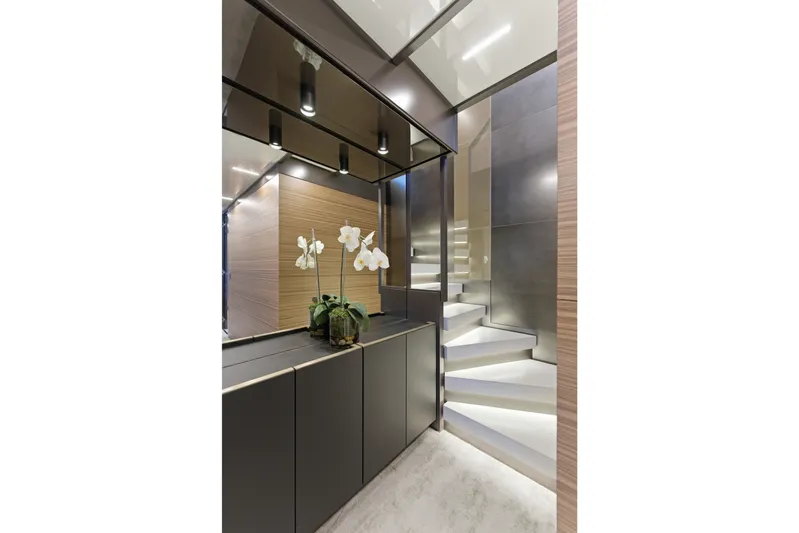 Date Night Yacht Photos Pics Luxurious interior of 2018 Ferretti Yachts 920 with modern staircase and elegant decor.