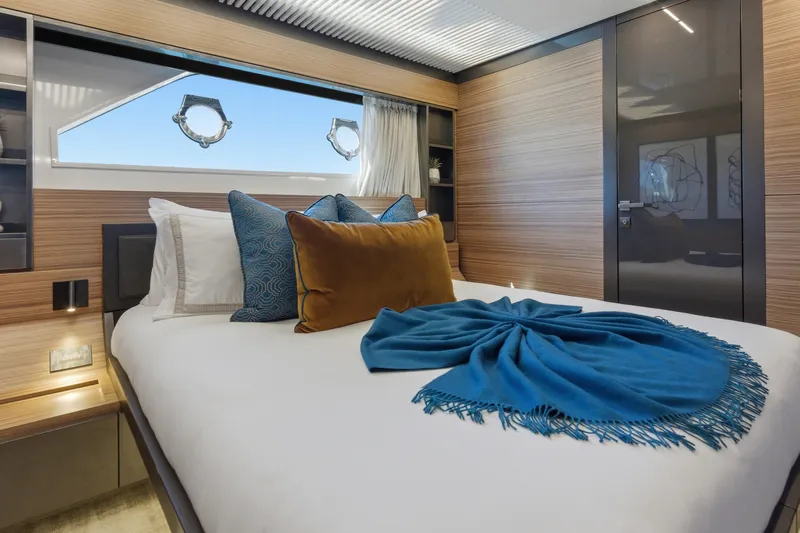 Date Night Yacht Photos Pics Luxurious bedroom interior of 2018 Ferretti Yachts 920 with elegant decor and ocean view.