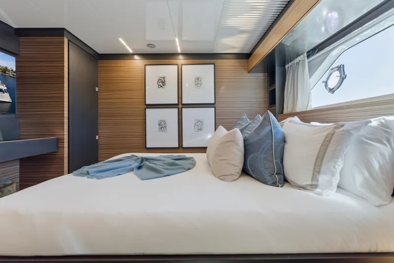Date Night Yacht Photos Pics Luxurious bedroom interior of 2018 Ferretti Yachts 920 with elegant decor and large window.