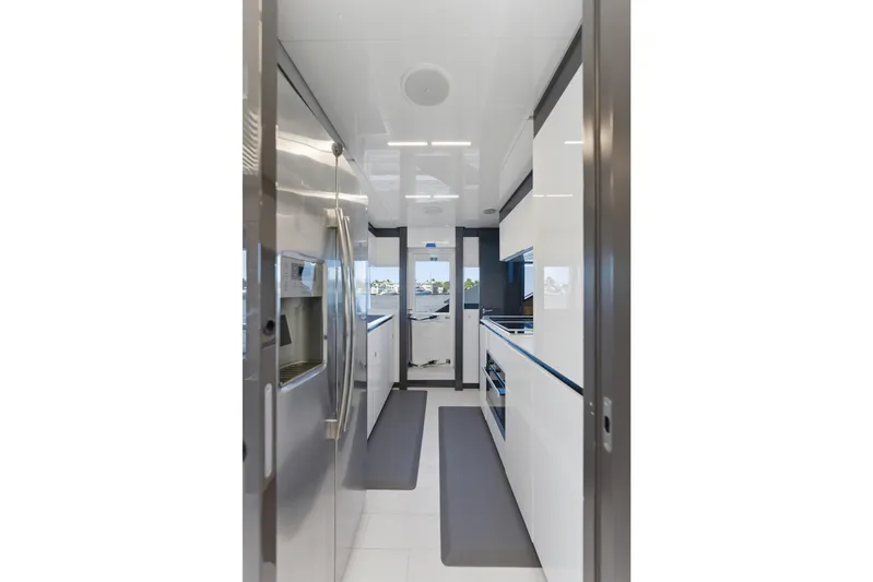 Date Night Yacht Photos Pics Modern kitchen interior of 2018 Ferretti Yachts 920, featuring sleek appliances and minimalist design.