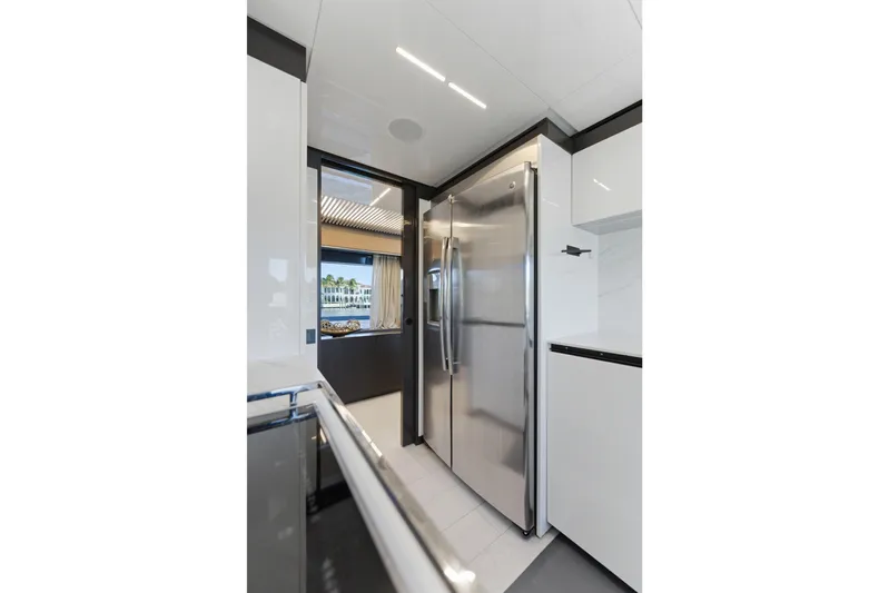 Date Night Yacht Photos Pics Modern kitchen interior on 2018 Ferretti Yachts 920, featuring sleek stainless steel appliances.