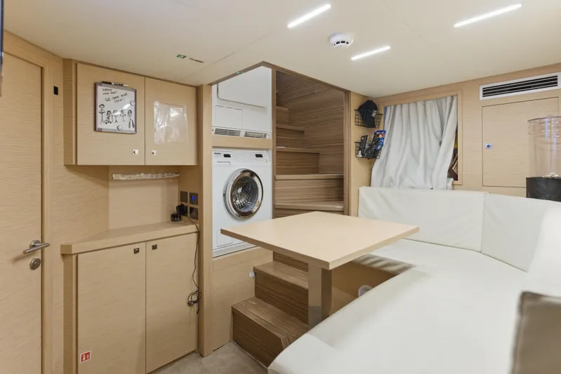 Date Night Yacht Photos Pics Interior of 2018 Ferretti Yachts 920 with modern seating, washer, and wooden accents.