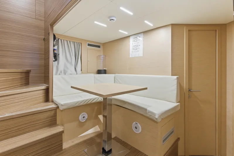 Date Night Yacht Photos Pics Luxurious interior of 2018 Ferretti Yachts 920 with modern seating and wooden finishes.