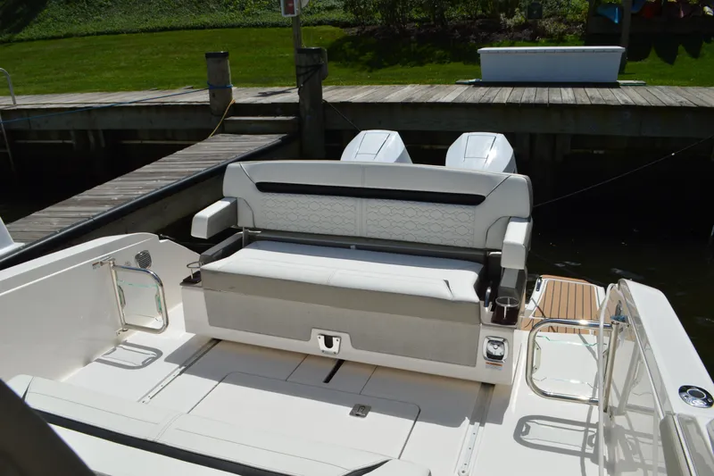 Station Break Yacht Photos Pics 2024 Tiara Yachts 34 LS boat interior with seating and dual engines at dock.