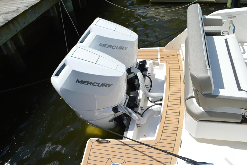 Station Break Yacht Photos Pics 2024 Tiara Yachts 34 LS with dual Mercury outboard engines, docked.