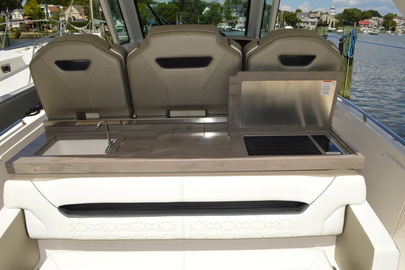 Station Break Yacht Photos Pics 2024 Tiara Yachts 34 LS boat interior with sink and grill station.