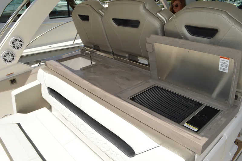 Station Break Yacht Photos Pics 2024 Tiara Yachts 34 LS boat interior with grill and sink setup.