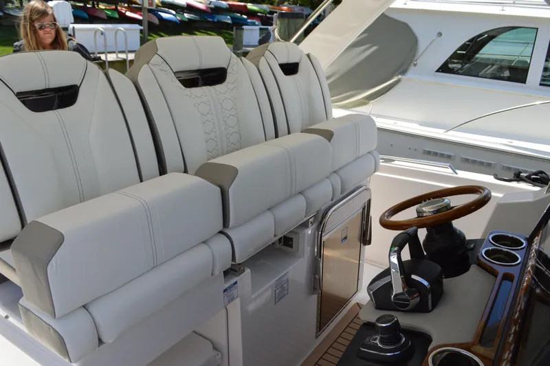 Station Break Yacht Photos Pics 2024 Tiara Yachts 34 LS interior with luxurious seating and modern helm controls.