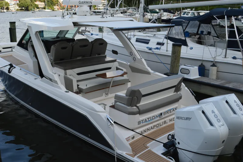 Station Break Yacht Photos Pics 2024 Tiara Yachts 34 LS docked, featuring dual Mercury engines and spacious seating.