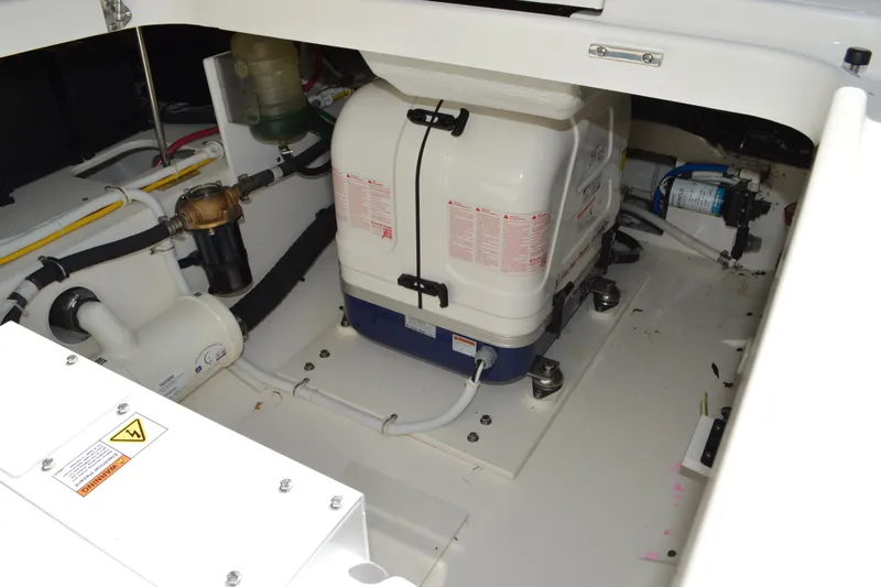 Station Break Yacht Photos Pics Engine compartment of 2024 Tiara Yachts 34 LS, showcasing mechanical components and systems.