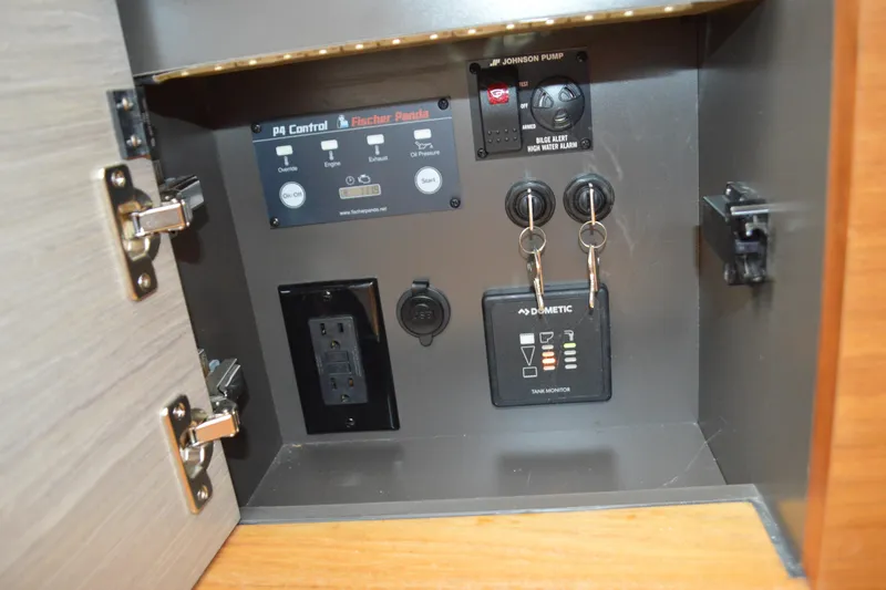 Station Break Yacht Photos Pics Control panel inside 2024 Tiara Yachts 34 LS, featuring switches and outlets.