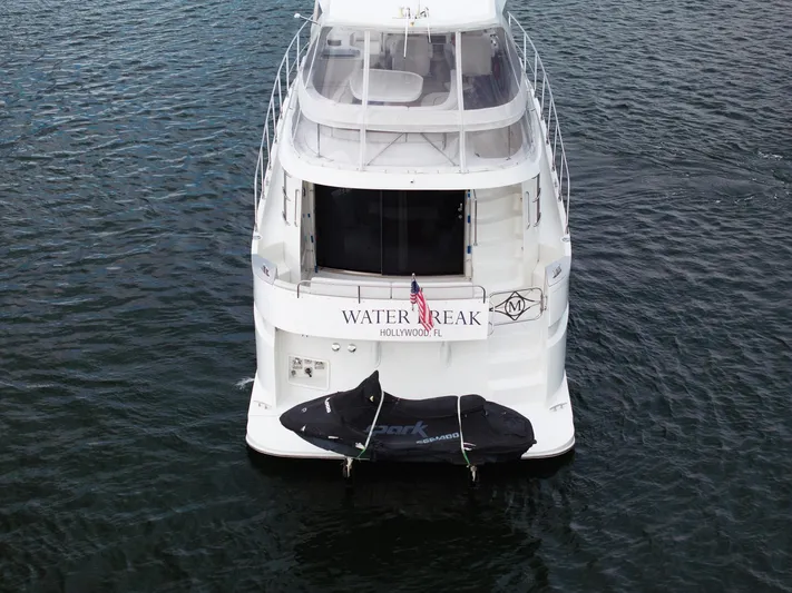 Water Break Yacht Photos Pics 2008 Marquis 50 LS yacht on water, rear view with covered equipment.