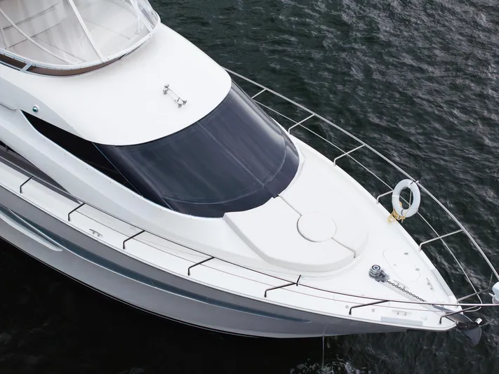 Water Break Yacht Photos Pics 2008 Marquis 50 LS yacht on water, aerial view of sleek design and deck.