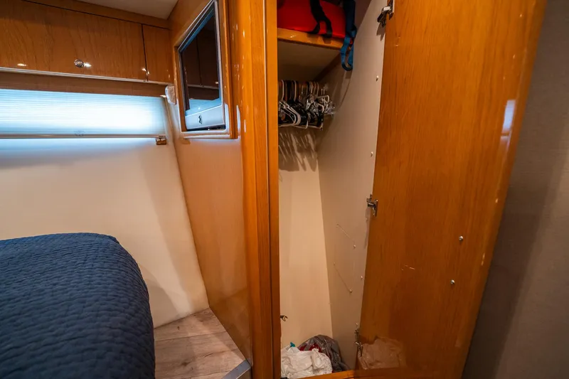 Water Break Yacht Photos Pics Interior of 2008 Marquis 50 LS yacht with open closet and bed.