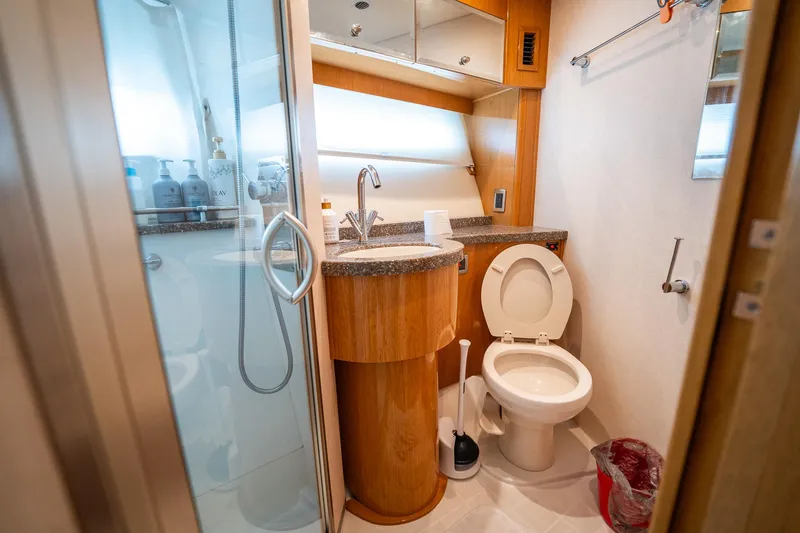 Water Break Yacht Photos Pics Luxurious bathroom in a 2008 Marquis 50 LS yacht with modern amenities.