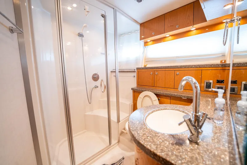 Water Break Yacht Photos Pics Luxurious bathroom in a 2008 Marquis 50 LS yacht with modern fixtures and elegant design.