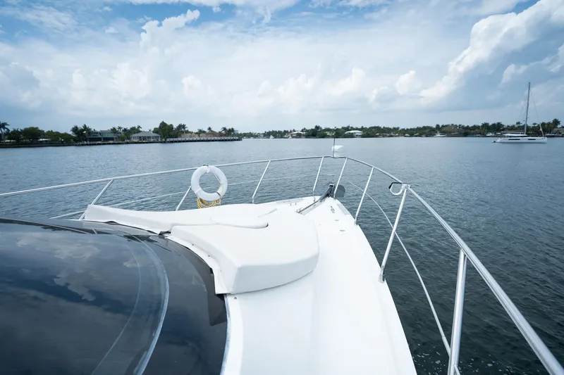 Water Break Yacht Photos Pics 2008 Marquis 50 LS yacht cruising on a serene lake under a partly cloudy sky.