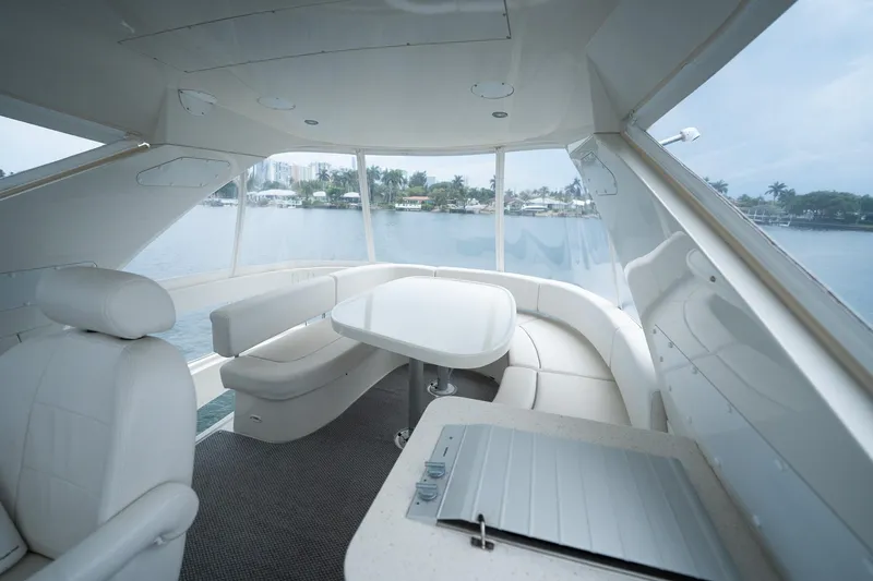 Water Break Yacht Photos Pics Luxurious interior of a 2008 Marquis 50 LS yacht with elegant seating and panoramic windows.