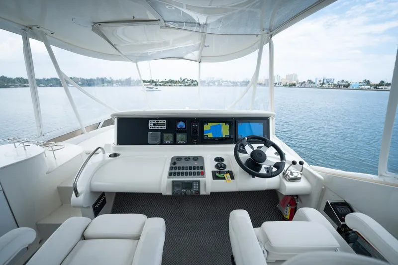 Water Break Yacht Photos Pics Helm of 2008 Marquis 50 LS yacht with navigation equipment and scenic water view.