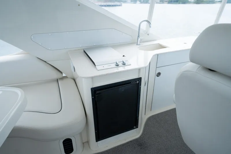 Water Break Yacht Photos Pics Interior of 2008 Marquis 50 LS yacht with kitchenette and seating area.