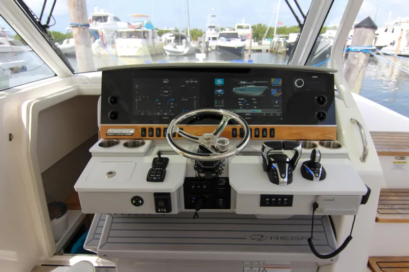  Yacht Photos Pics Helm of 2023 Regal 38 SAV boat with advanced navigation controls and displays.