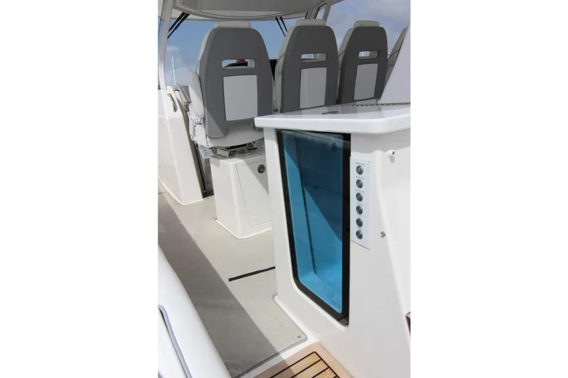  Yacht Photos Pics 2023 Regal 38 SAV boat interior with modern seating and control panel.
