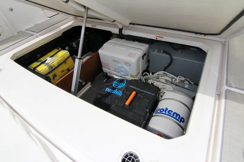  Yacht Photos Pics 2023 Regal 38 SAV storage compartment with equipment and safety gear.