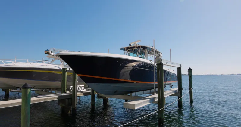  Yacht Photos Pics 2009 Hydra-Sports 4200 SF boat docked on a lift in sunny marina.