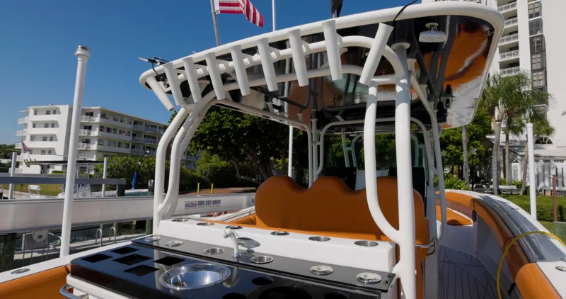  Yacht Photos Pics 2009 Hydra-Sports 4200 SF boat with sleek design and modern amenities, docked near buildings.