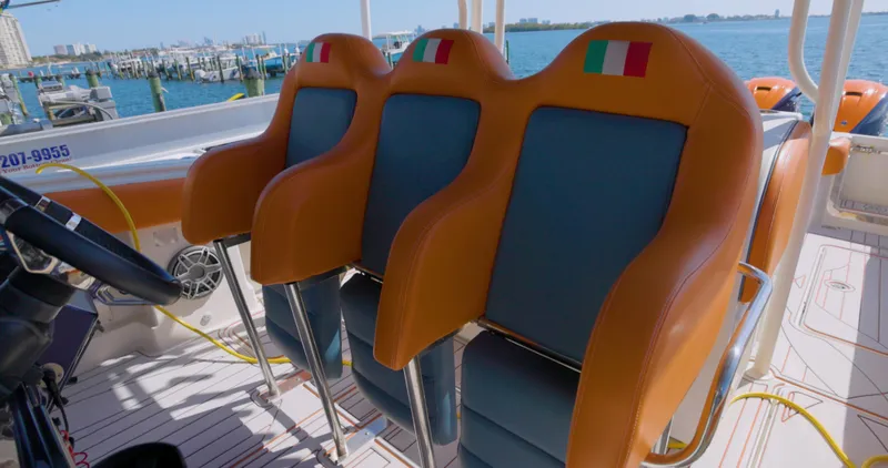  Yacht Photos Pics Orange and blue seats on a 2009 Hydra-Sports 4200 SF boat.