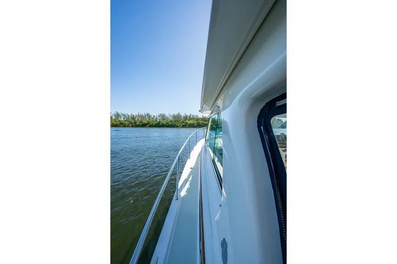  Yacht Photos Pics 2020 Back Cove 340 yacht side view on calm water under clear blue sky.