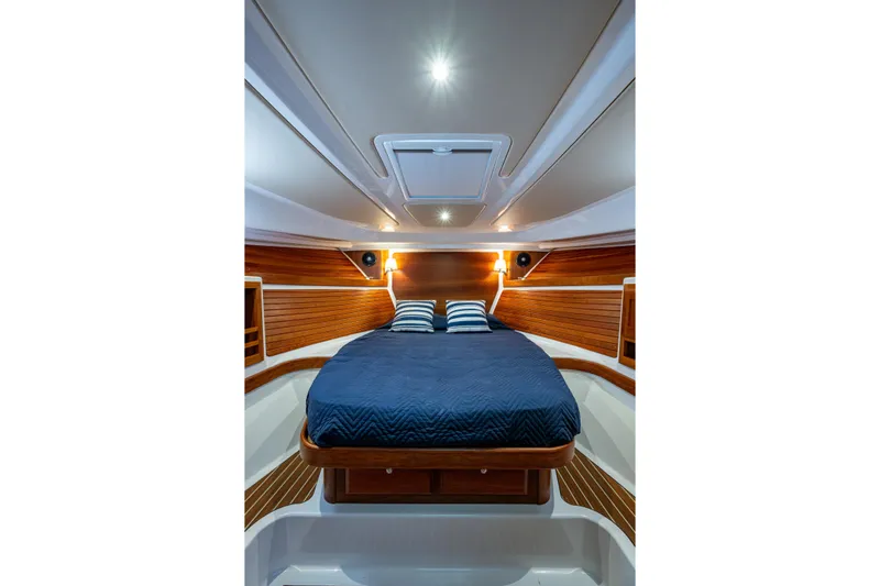  Yacht Photos Pics Luxurious cabin interior of 2020 Back Cove 340 yacht with elegant wood paneling.