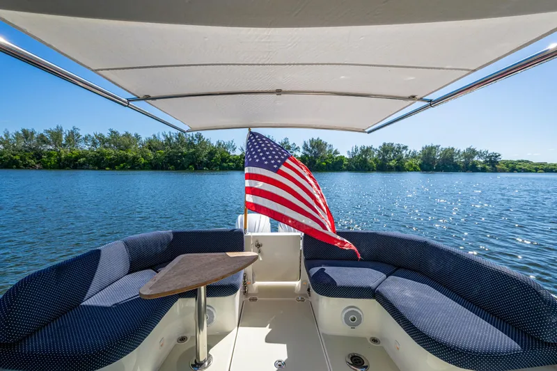  Yacht Photos Pics 2020 Back Cove 340 boat interior with American flag, scenic water view.