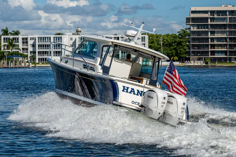  Yacht Photos Pics 2020 Back Cove 340 boat cruising with American flag, powered by Yamaha engines.
