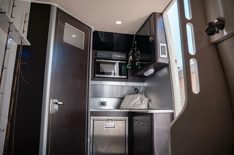 O-sea-d Yacht Photos Pics Interior of 2020 Scout 380 LXF boat featuring modern kitchenette and storage.