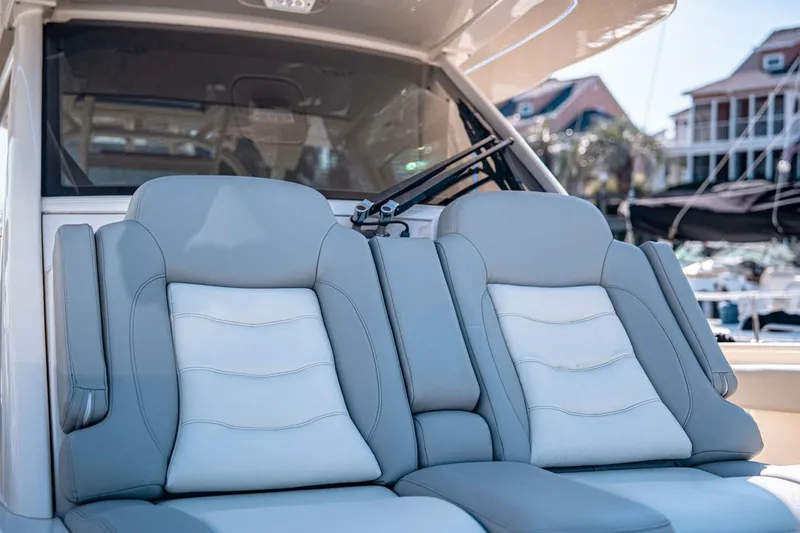O-sea-d Yacht Photos Pics Luxury seating on 2020 Scout 380 LXF boat, featuring plush gray and white upholstery.