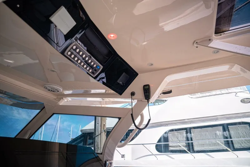 O-sea-d Yacht Photos Pics Interior view of 2020 Scout 380 LXF boat cockpit with control panel.