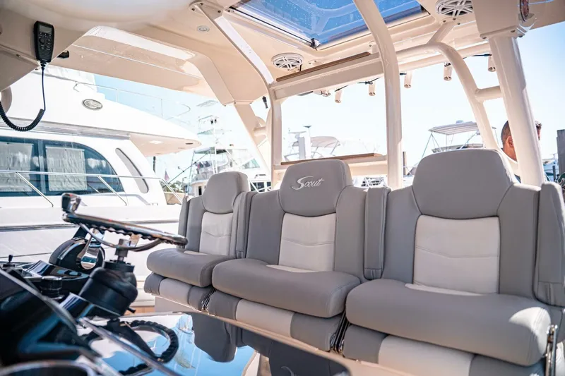 O-sea-d Yacht Photos Pics Luxury seating on 2020 Scout 380 LXF boat, featuring plush gray and white upholstery.