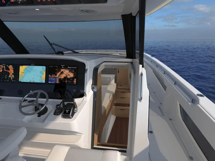 Aquila Molokai 47 Yacht Photos Pics 2026 Aquila 47 Molokai yacht cockpit with navigation screens, steering wheel, and ocean view.