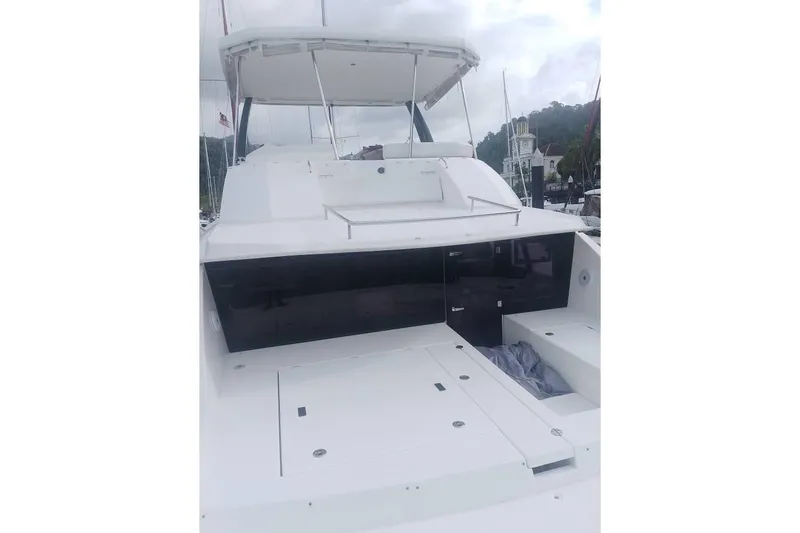  Yacht Photos Pics Leopard 43 Powercat yacht with spacious deck and sleek design, docked at marina.