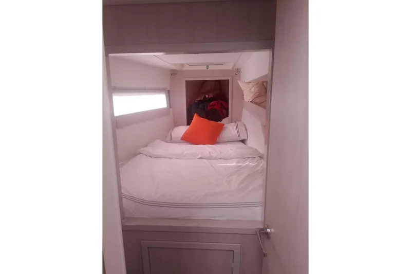  Yacht Photos Pics Cozy cabin interior of Leopard 43 Powercat with bed and orange pillow.