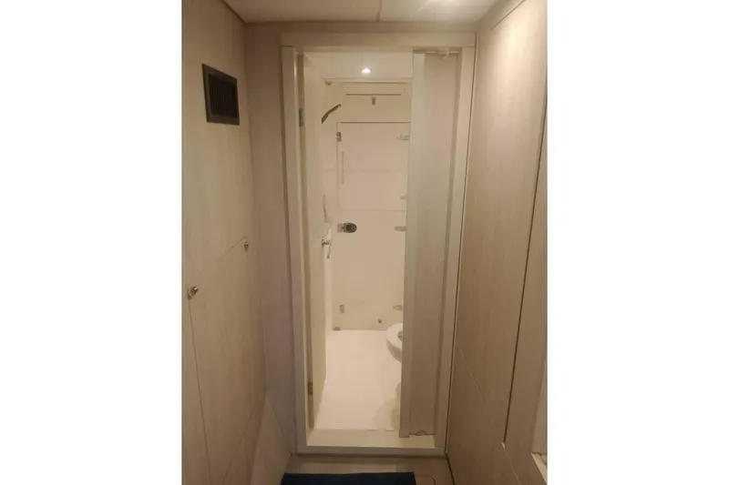  Yacht Photos Pics Bathroom interior of Leopard 43 Powercat yacht, featuring modern design and compact layout.