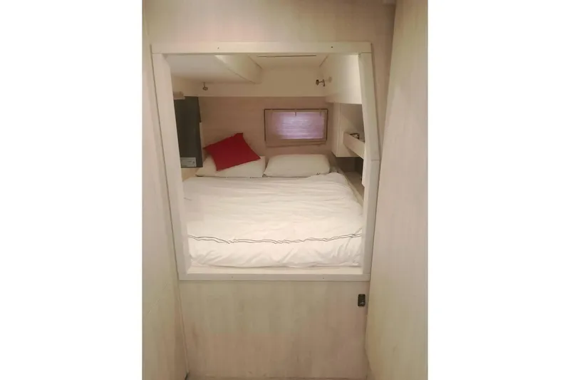  Yacht Photos Pics Cozy cabin interior of Leopard 43 Powercat with bed and red pillow.