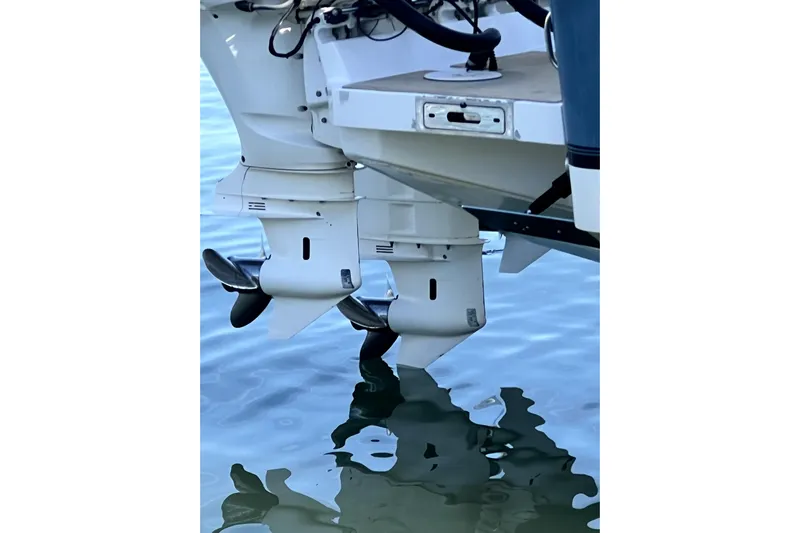  Yacht Photos Pics 2018 Regulator 34 Center Console boat with dual outboard motors on water.
